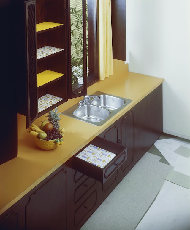 brown and yellow small kitchen