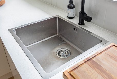 kitchen drain with black faucet