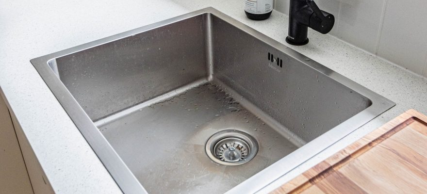 kitchen drain with black faucet