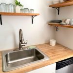 kitchen sink with stainless faucet