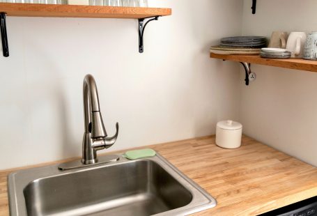 kitchen sink with stainless faucet