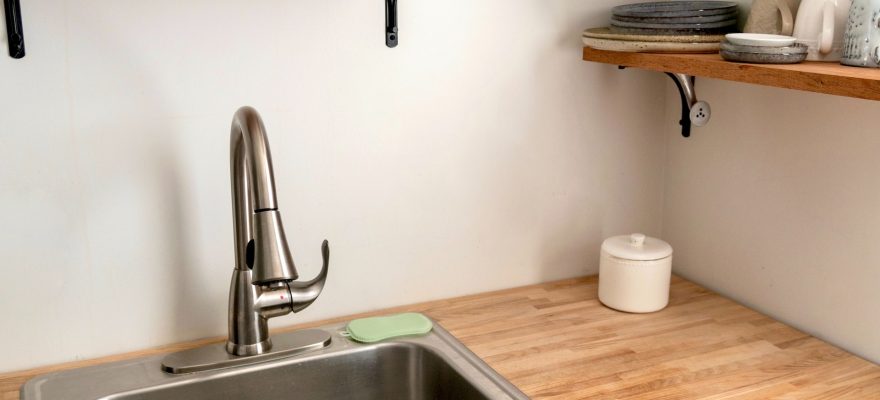 kitchen sink with stainless faucet